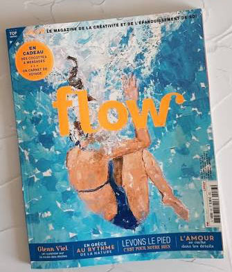 Flow magazine cover with two swimmers underwater, orange 'flow' logo across the blue water background, bar code on the right.