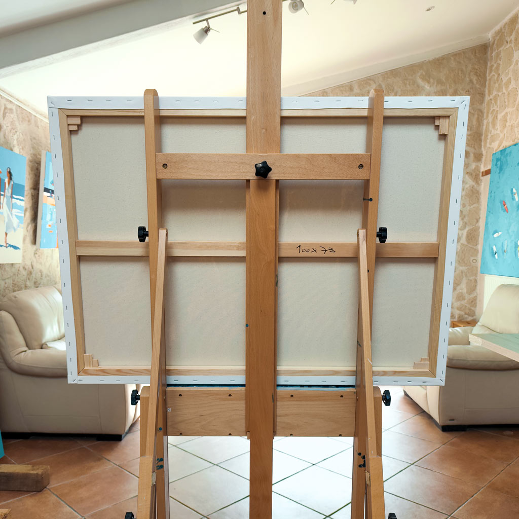 Dos d'une peinture originale sur châssis en bois à clés, dimensions 100x73 cm écrites au dos de la toile posée sur un chevalet